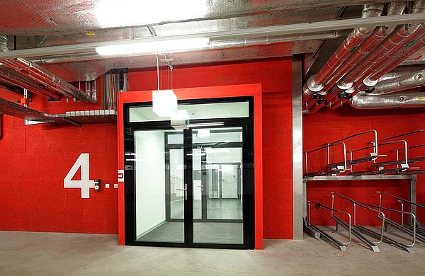 fire-rated door in all-glass design at the entrance to the parking, forster fuego light 
Westlink, Zurich