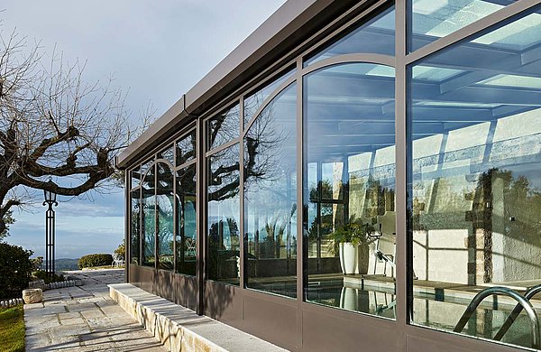 Thermally insulated glazing around the indoor swimming pool area. Profile system forster unico. Hotel and SPA "Bastide de Tourtour" in France.